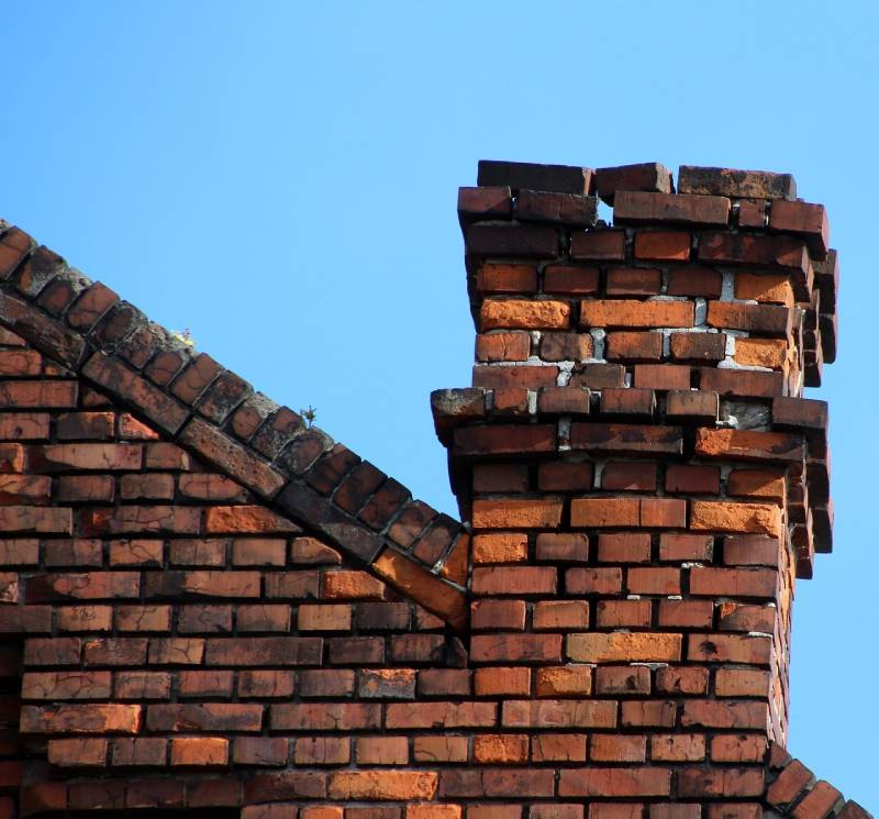 Signs Your Alhambra Home Needs a Chimney Inspection Damaged chimney on an Alhambra home showing cracks and missing mortar